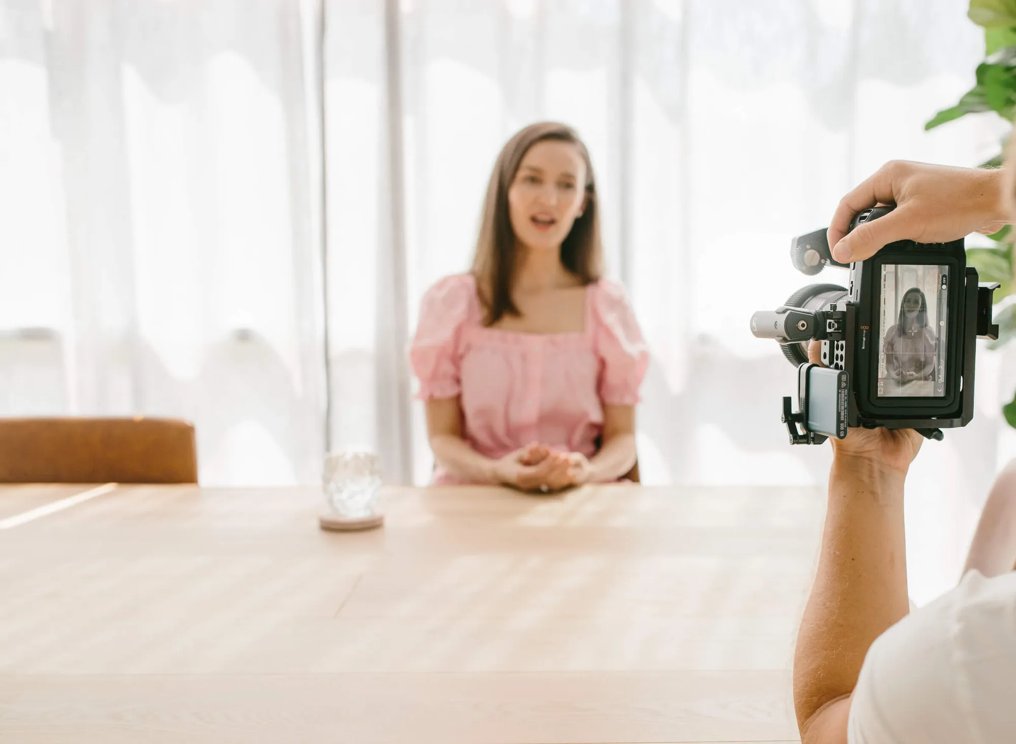 Videographer filming a business owner for a marketing video