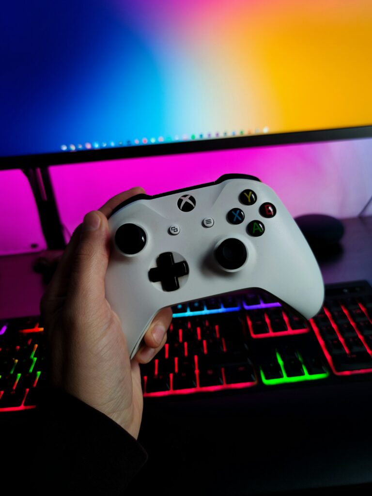A Person Connecting An Xbox Controller To A Pc.