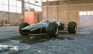 A classic green racing car is parked in an industrial garage with brick walls and large windows, reminiscent of the exclusive collections you might find through sites like LMCTplus.