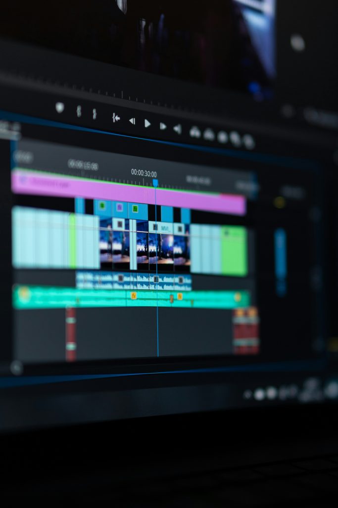 A computer screen displays a video editing timeline adorned with various clips and tracks in different colors, showcasing the seamless integration of effects like cross dissolves.