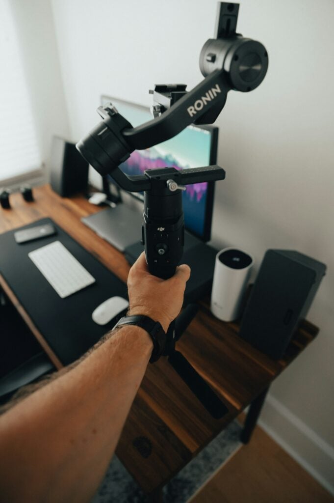 A Hand Holding A Video Camera Demonstrating Stability.