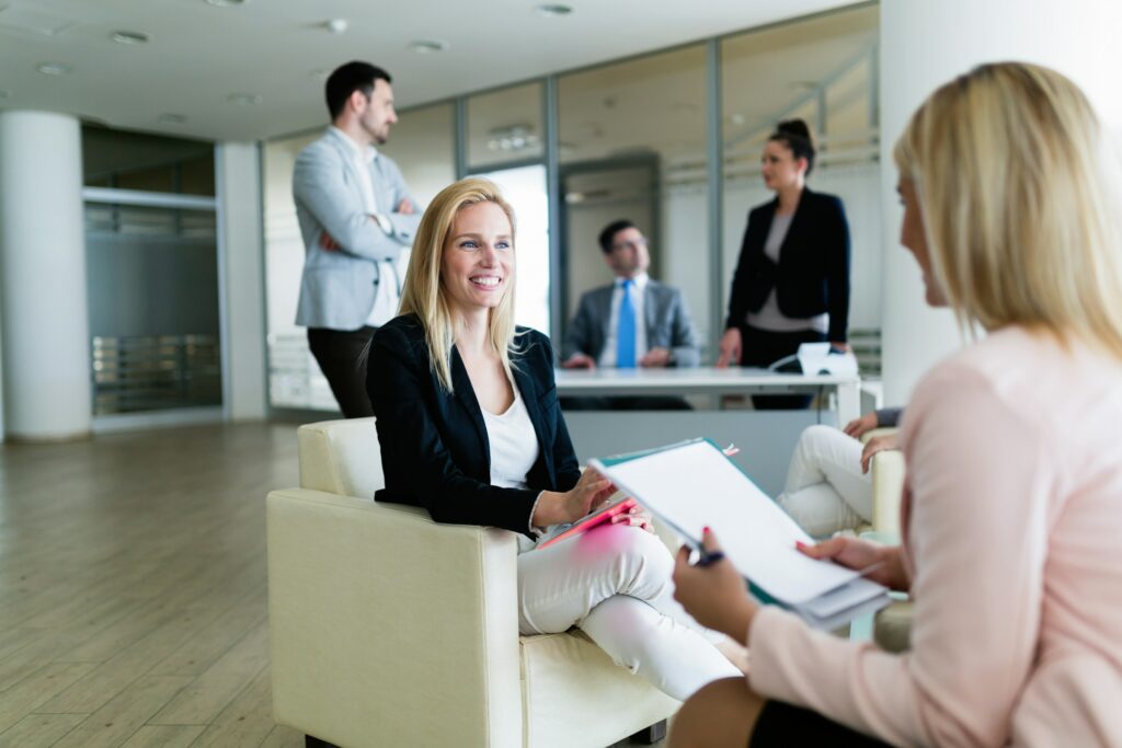 A Group Of Business People Sitting In An Office In Australia.