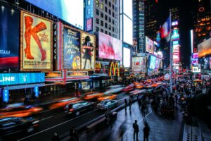 Vibrant evening traffic and illuminated billboards enhance the stickiness factor at Times Square, New York City.