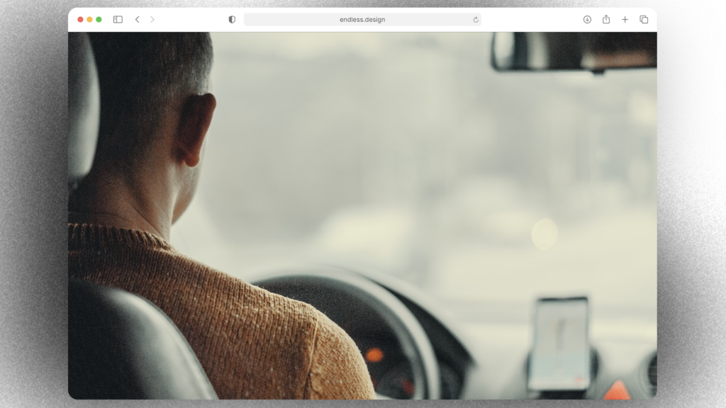 A man sitting in the driver's seat of a car, contemplating his side hustle opportunities in Australia.