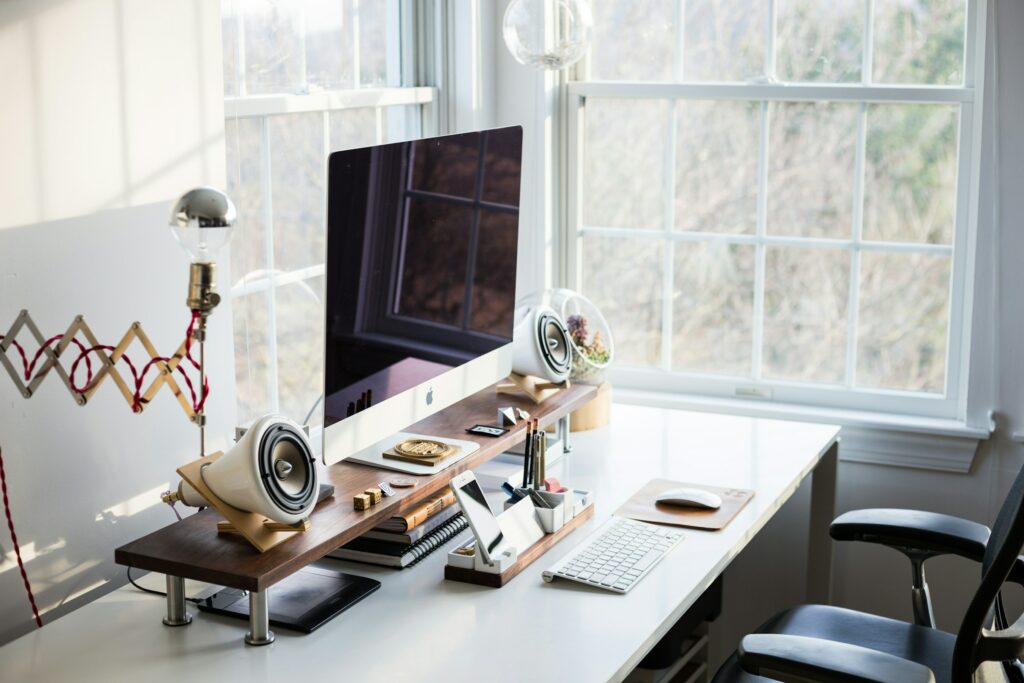 Home Office Essentials: A desk equipped with a monitor, keyboard, and mouse - 2024's Top 10.