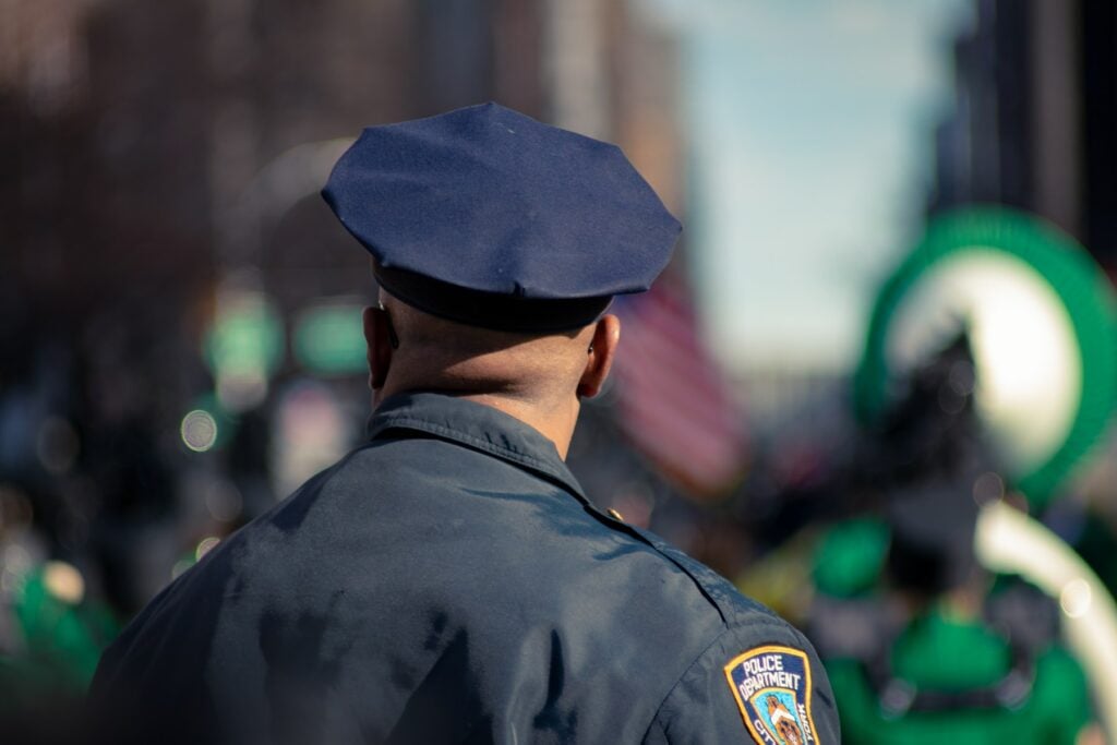 Empowering police officer wears hat.