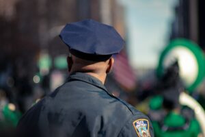 Empowering police officer wears hat.