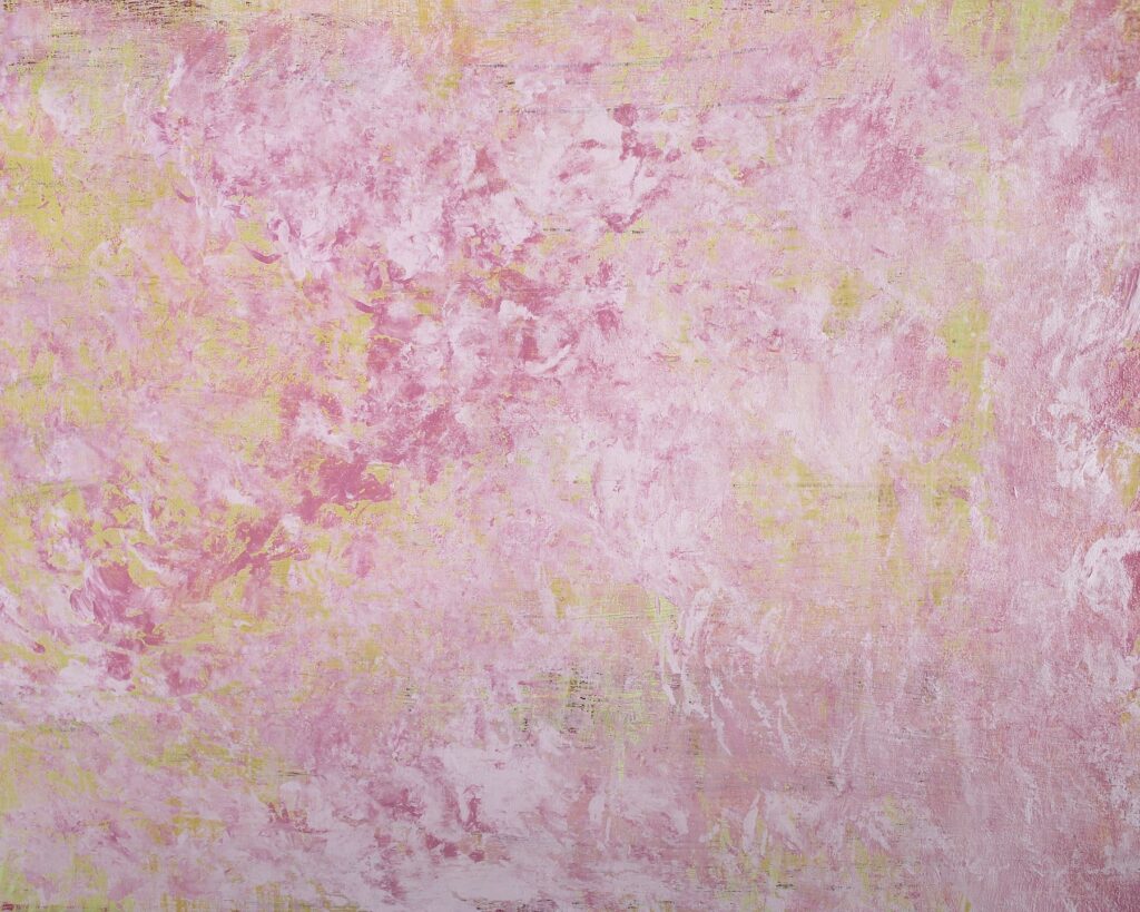 A vibrant painting with pink and yellow paint on it.
