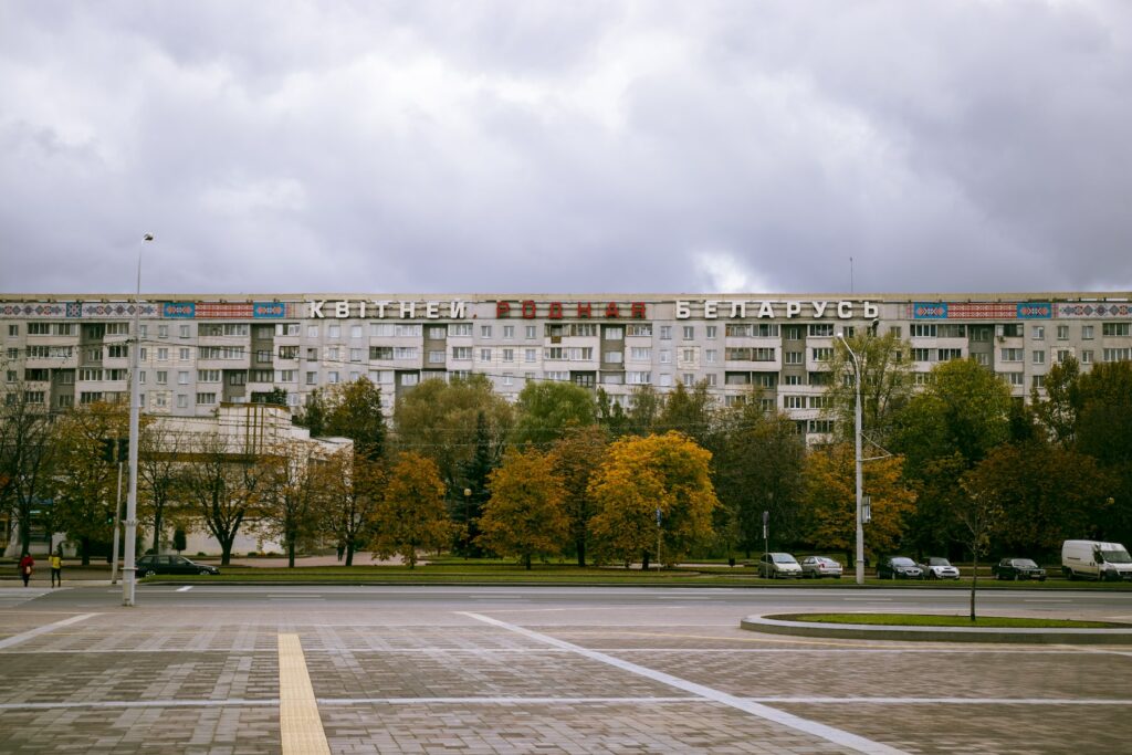 A large building in the middle of a parking lot.