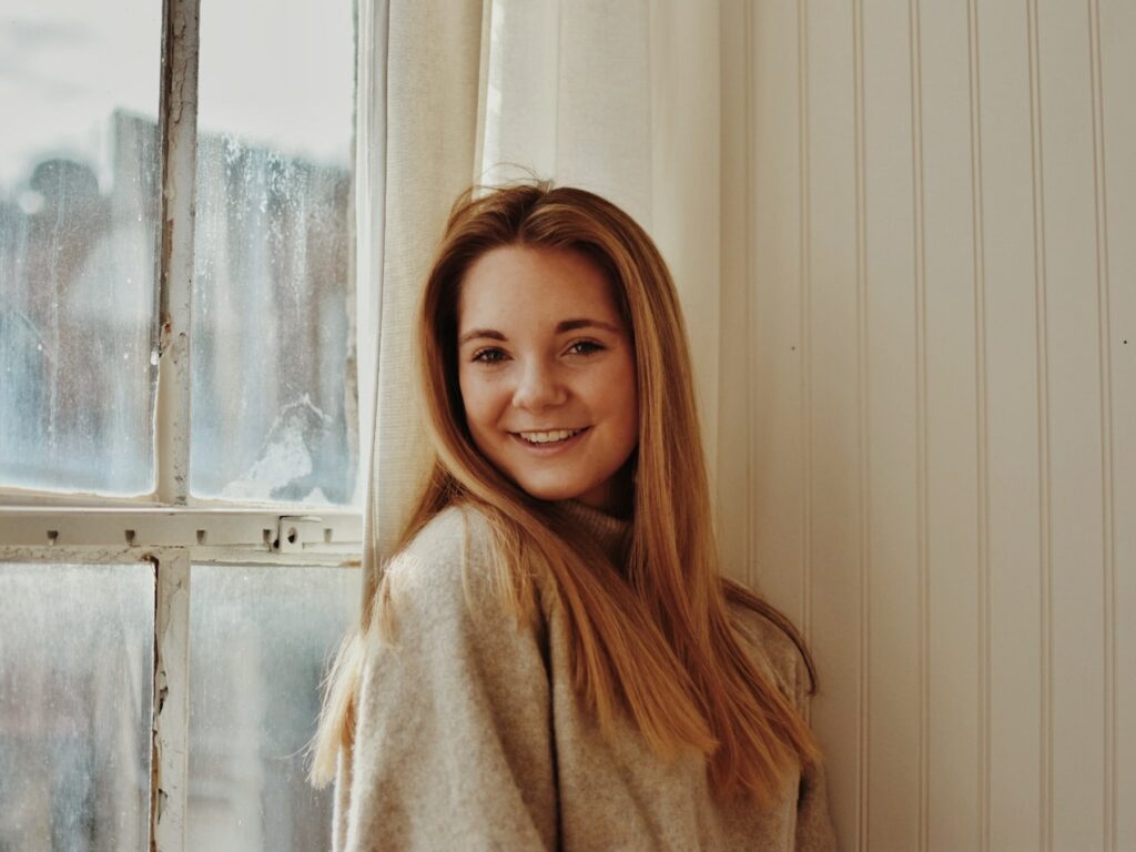 A young woman revolutionizing the IT industry by unveiling 'Owl', a language model designed for tech domains.